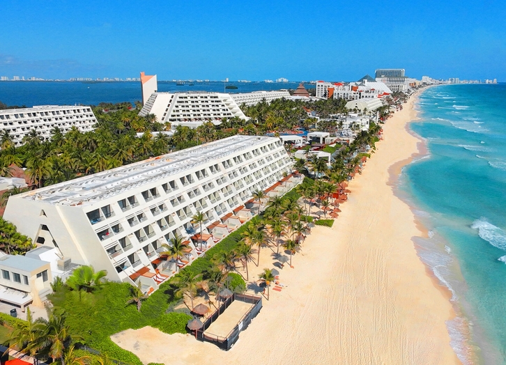 Aerial view of The Pyramid Cancun hotel, the white sand beach and the turquoise sea
